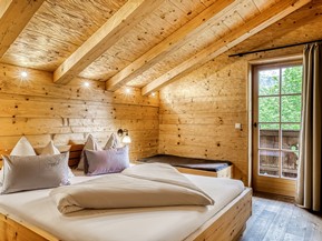 Bedroom at the Private Spa Chalet Deluxe at Naturresort Puradies Bedroom at the Private Spa Chalet Deluxe at Naturresort Puradies