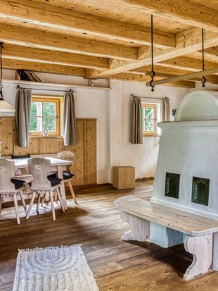 Dining Area with Tiled Stove at the Private Spa Chalet Deluxe at Naturresort Puradies Dining area with tiled stove at the Private Spa Chalet Deluxe at Naturresort Puradies