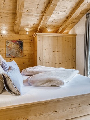 Bedroom at the Private Spa Chalet Honeymoon at Naturresort Puradies Bedroom at the Private Spa Chalet Honeymoon at Naturresort Puradies