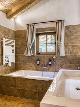 Bathroom with Double Washbasin and Sauna at the Private Spa Chalet Puradies x Moroso at Naturresort Puradies Bathroom with double washbasin and sauna at the Private Spa Chalet Puradies x Moroso at Naturresort Puradies