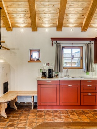 Kitchen with Tiled Stove at the Private Spa Chalet Puradies x Moroso at Naturresort Puradies Kitchen with tiled stove at the Private Spa Chalet Puradies x Moroso at Naturresort Puradies