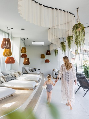 Woman with Child in the Relaxation Room of the Heaven Spa, Naturresort Puradies, Leogang, Salzburger Land Woman with child in the relaxation room of the Heaven Spa, Puradies Leogang