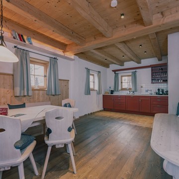 Living, Dining, and Kitchen Area in the Chalet at Puradies in Winter, Naturresort Puradies, Leogang Living and dining area in the chalet at Naturresort Puradies in winter