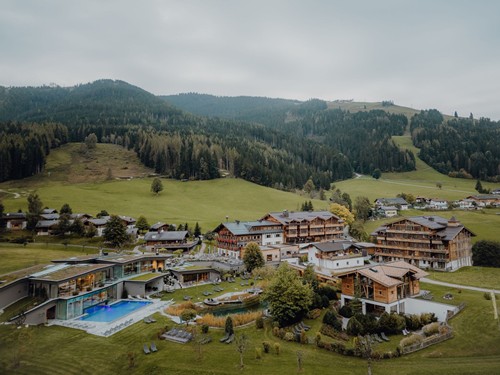Aerial View of the Entire Resort in Autumn Under Cloudy Skies at Naturresort Puradies, Leogang, Salzburger Land Aerial view of the entire resort in autumn, Puradies Leogang